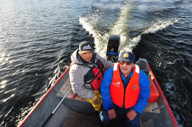 Former WRRB Board Chair Joseph Judas and Board member Jonas Lafferty setting off by boat (Photo:  Paul Vecsei, Golder Associates Ltd.)