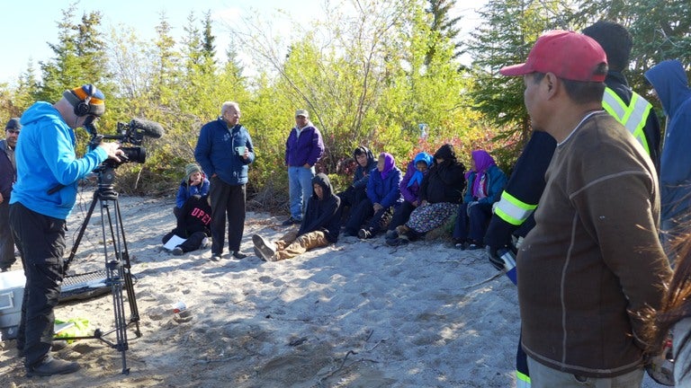Alan filming water sampling demonstration