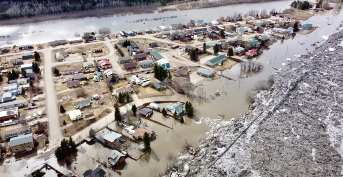 Photo credit: Flooding in Fort Simpson on May 12, 2021. FearFighters Mech Drones 3DP Gaming/YouTube https://cabinradio.ca/66605/news/dehcho/nwt-will-cover-all-repairs-for-flood-affected-residents/