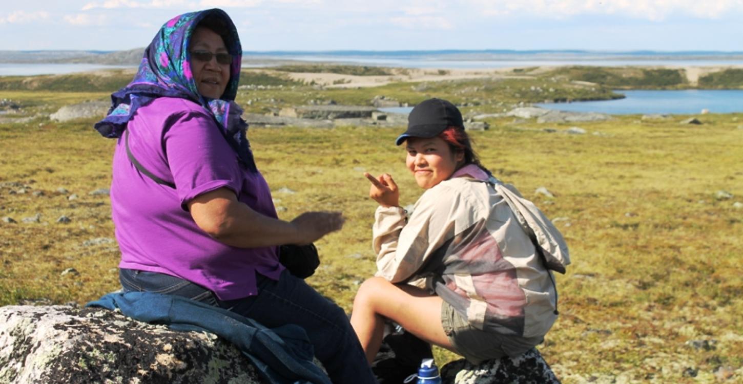 TSSRAP summer student Teya Wetrade learning from elder Rita Wetrade at Science and Culture Camp. Photo © GNWT / Stephanie Yuill