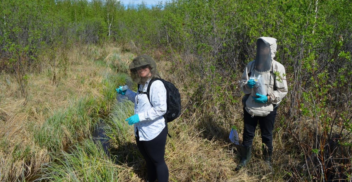 The Communications Officer, Shalyn Norrish, doing a little water sampling at one of the sites with Jessica Pacunayen, Regulatory Specialist for the WLWB, overseeing the process. Photo Credit: Brodie Costello, WLWB. 