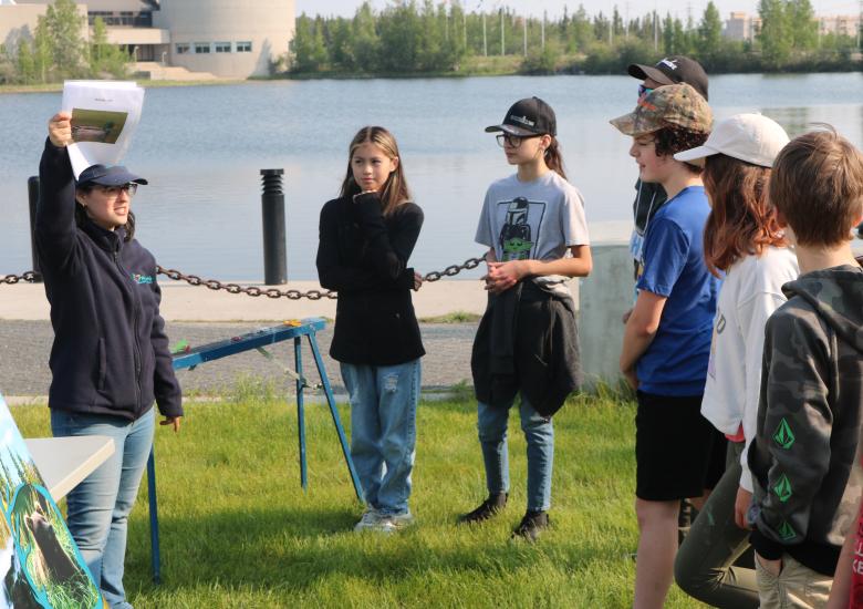 Wildlife Management Biologist Laura Meinert talks with students about the primary diet of local northern species. Simon Whitehouse/WRRB 